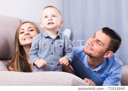 Young mother and father with little son 72818840