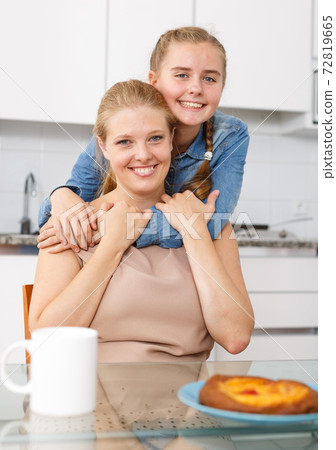 Cheerful teenage girl and her mother 72819665