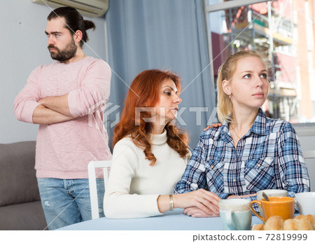 Mother comforting young daughter after a family conflict 72819999