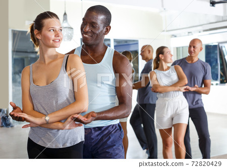 Ordinary positive people dancing samba in pairs 72820429