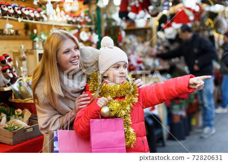 Family shopping on Christmas market Family shopping on Christmas market 72820631