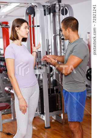 Sporty man coaching girl Sporty man coaching girl 72821241