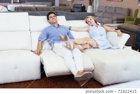 Couple who are choosing new sofa-transformer Couple who are choosing new sofa-transformer 72822415
