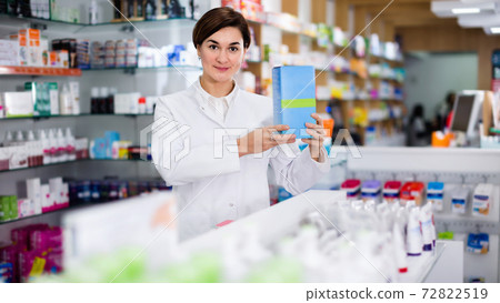 Female pharmacist suggesting useful body care products Female pharmacist suggesting useful body care products 72822519