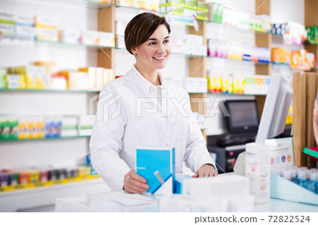 Pharmacist ready to assist in choosing at counter Pharmacist ready to assist in choosing at counter 72822524