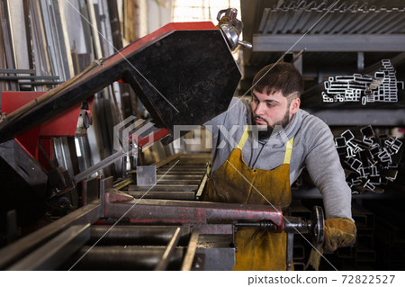 Professional man worker during work in workshop Professional man worker during work in workshop 72822527