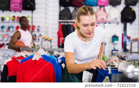 Girl buying sportswear Girl buying sportswear 72822528