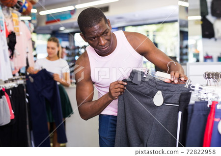 Man buying sportswear Man buying sportswear 72822958
