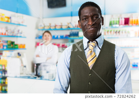 African American customer in pharmacy 72824262