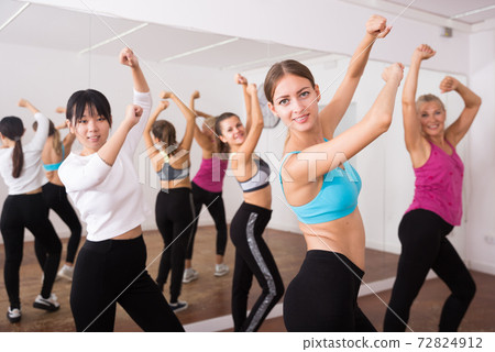 Fitness women practicing zumba movements Fitness women practicing zumba movements 72824912