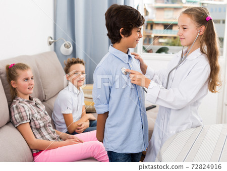 Doctor girl in uniform with stethoscope Doctor girl in uniform with stethoscope 72824916