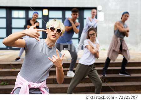 Portrait of teenager boy performing hip hop at street Portrait of teenager boy performing hip hop at street 72825707