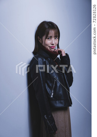 Woman wearing a leather jacket Woman wearing a leather jacket 72828126