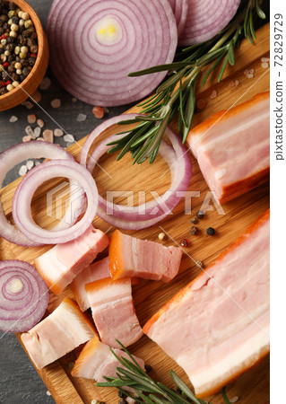 Concept of tasty snack with bacon on wooden board 72829729