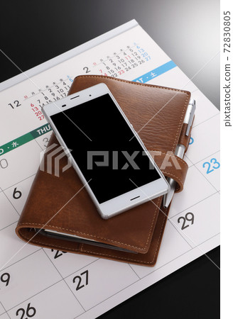 Smartphone, notebook and calendar 72830805