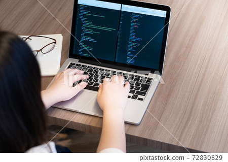 Young woman studying programming Young woman studying programming 72830829