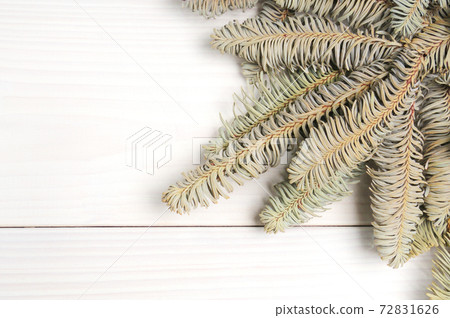 Christmas white wooden pattern with Christmas tree branches and toys Christmas white wooden pattern with Christmas tree branches and toys 72831626