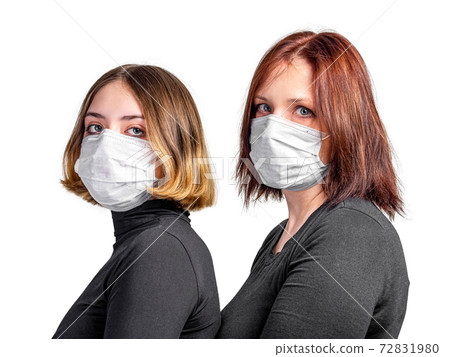Girl and woman in medical protective mask Girl and woman in medical protective mask 72831980