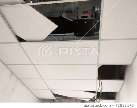 KUALA LUMPUR, MALAYSIA -APRIL 26, 2020: Installation of suspended ceiling frame and finishes. All the above-ceiling services and equipment. installed before that. All the installation work to be coord KUALA LUMPUR, MALAYSIA -APRIL 26, 2020: Installation of suspended ceiling frame and finishes. All the above-ceiling services and equipment. installed before that. All the installation work to be coord 72832176