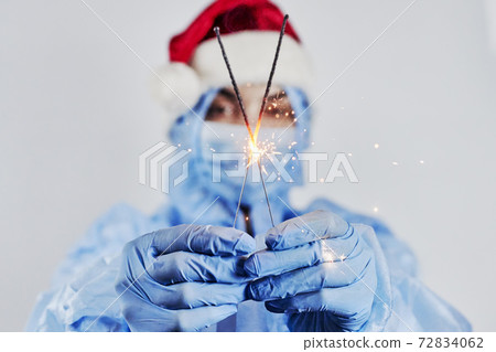 Celebrating Christmas in hospital. Doctor celebrate New YEAR 2021 at wrok Celebrating Christmas in hospital. Doctor celebrate New YEAR 2021 at wrok 72834062