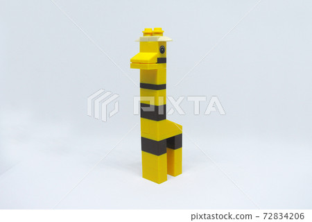 The shape of a giraffe made from colorful plastic toy bricks isolated on white background. The shape of a giraffe made from colorful plastic toy bricks isolated on white background. 72834206