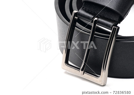 Black belt with a metal fastener on a white background 72836580