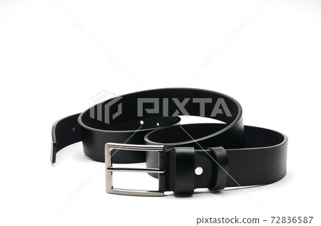 Black belt with a metal fastener on a white background 72836587
