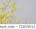 Abstract gray background with bright yellow wavy paper stripes. 72839512