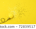One yellow decorative lamp on a gray background. 72839517