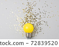 One yellow decorative lamp on a gray background. 72839520