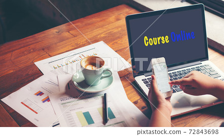 Course Online text on laptop screen on table with plant and coffee cup in the nature garden at home. Course Online text on laptop screen on table with plant and coffee cup in the nature garden at home. 72843698