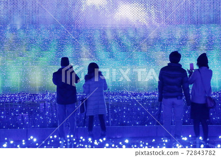 Tourists enjoying the illuminations (Nabana no Sato, Mie Prefecture) 72843782