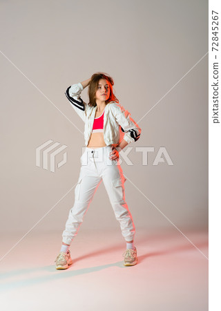 Teenage female dancing hip-hop in studio, casual clothes 72845267