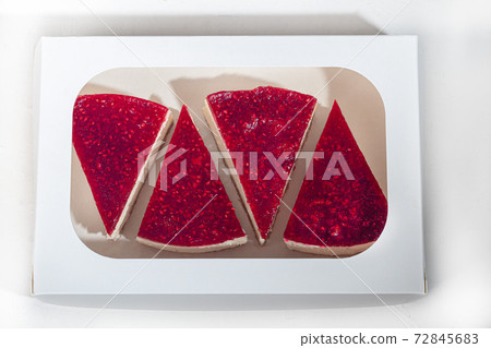 Cheesecake on a light background. Top with raspberry jelly. Home delivery. Festive concept. Quarantine. Cheesecake on a light background. Top with raspberry jelly. Home delivery. Festive concept. Quarantine. 72845683