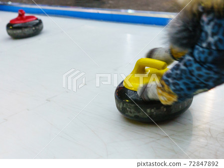 Yellow and red stones for game in Curling. Yellow and red stones for game in Curling. 72847892