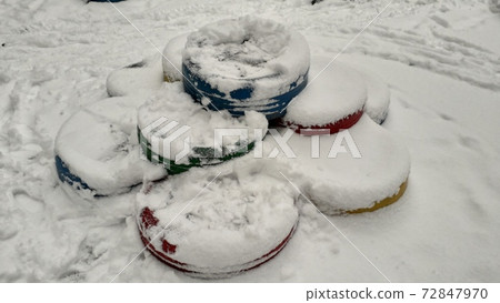 Snow-covered small architectural forms in the playground 72847970