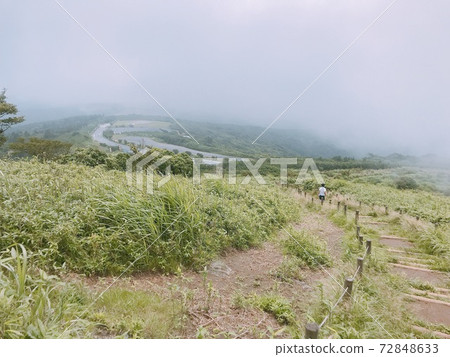 A haze-covered mountain path A haze-covered mountain path 72848633
