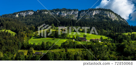 Rural Landscape With Mountains And Cottages In The Alps Of Austria Rural Landscape With Mountains And Cottages In The Alps Of Austria 72850068