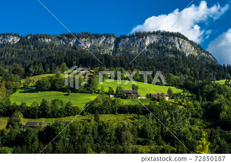Rural Landscape With Mountains And Cottages In The Alps Of Austria Rural Landscape With Mountains And Cottages In The Alps Of Austria 72850187