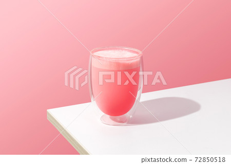 Pink rose milkshake in a transparent glass 72850518