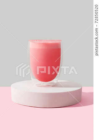 Pink rose milkshake in a transparent glass 72850520