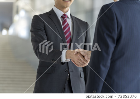 Handshake business scene image Handshake business scene image 72852376