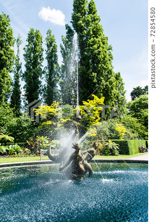 The historic Triton and Dryads in Regent's Park in bright sunlight The historic Triton and Dryads in Regent's Park in bright sunlight 72854580