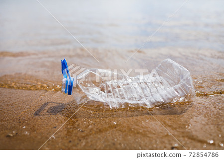 wasted plastic bottle on beach wasted plastic bottle on beach 72854786