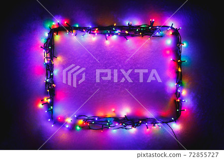 Christmas lights frame on snow background, purple color Christmas lights frame on snow background, purple color 72855727