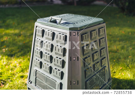 compost bin on green grass background compost bin on green grass background 72855738