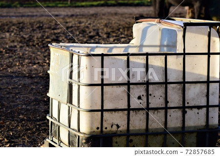 Big white water container for animals on a paddock 72857685