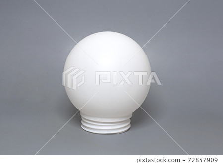 Round white lampshade on grey background Round white lampshade on grey background 72857909