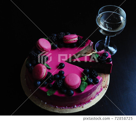 Delicious cake with fresh strawberries, raspberries, blueberry, currants. cut piece of cake and blade on wooden background. Delicious cake with fresh strawberries, raspberries, blueberry, currants. cut piece of cake and blade on wooden background. 72858725