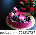 Delicious cake with fresh strawberries, raspberries, blueberry, currants. cut piece of cake and blade on wooden background. 72858727
